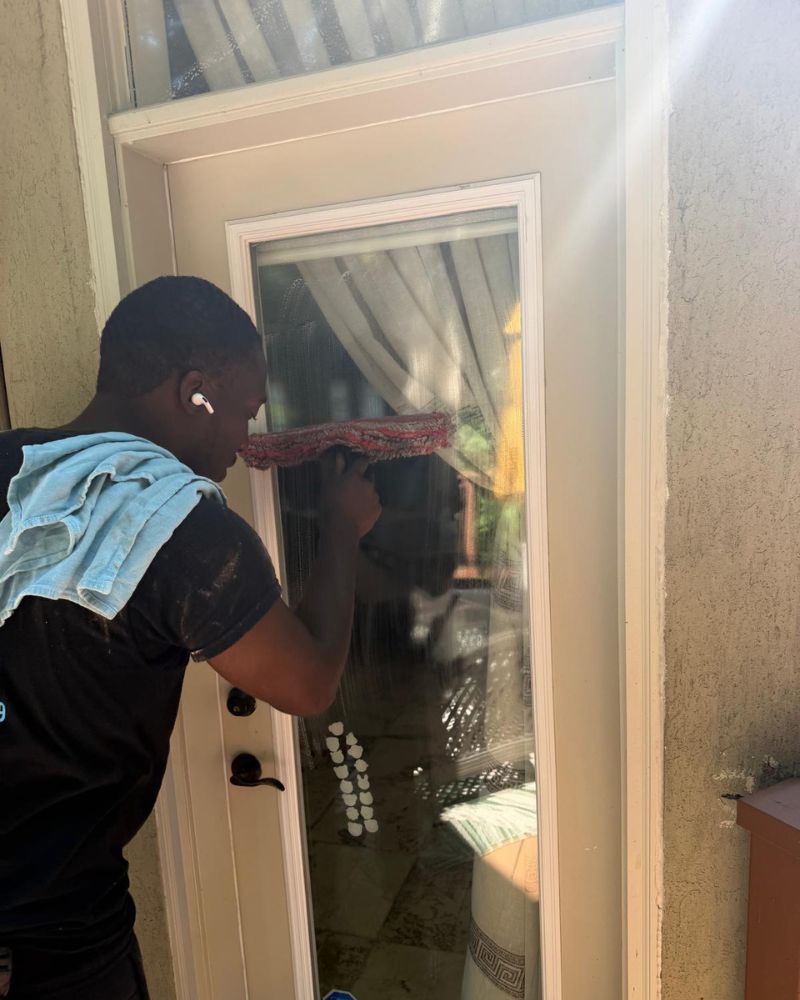 Professional technician performing precision glass cleaning in Willowdale, North York