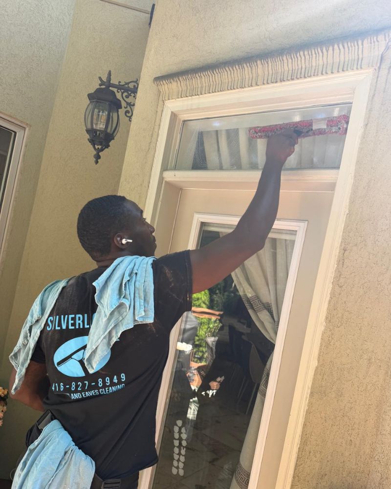 Silverlight Windows and Eaves technician hand-detailing residential window frames in North York.